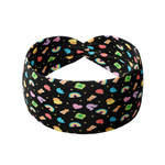 You're My Lucky Charm black headband featuring colorful Lucky Charms cereal designs with a twist-knot detail. Versatile, non-slip, buttery-soft fabric for workouts or daily wear.