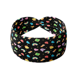 You're My Lucky Charm black headband featuring colorful Lucky Charms cereal designs with a twist-knot detail. Versatile, non-slip, buttery-soft fabric for workouts or daily wear.