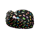 You're My Lucky Charm black headband featuring colorful Lucky Charms cereal designs with a twist-knot detail. Versatile, non-slip, buttery-soft fabric for workouts or daily wear.