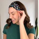 Woman with long hair confidently smiles in the You're My Lucky Charm headband, the perfect non-slip hair accessory for all day wear.