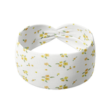 Goldie Floral on Ivory headband featuring small butter yellow flowers, crafted from a buttery-soft, ultra-stretchy poly-knit blend, designed for versatility and comfort.