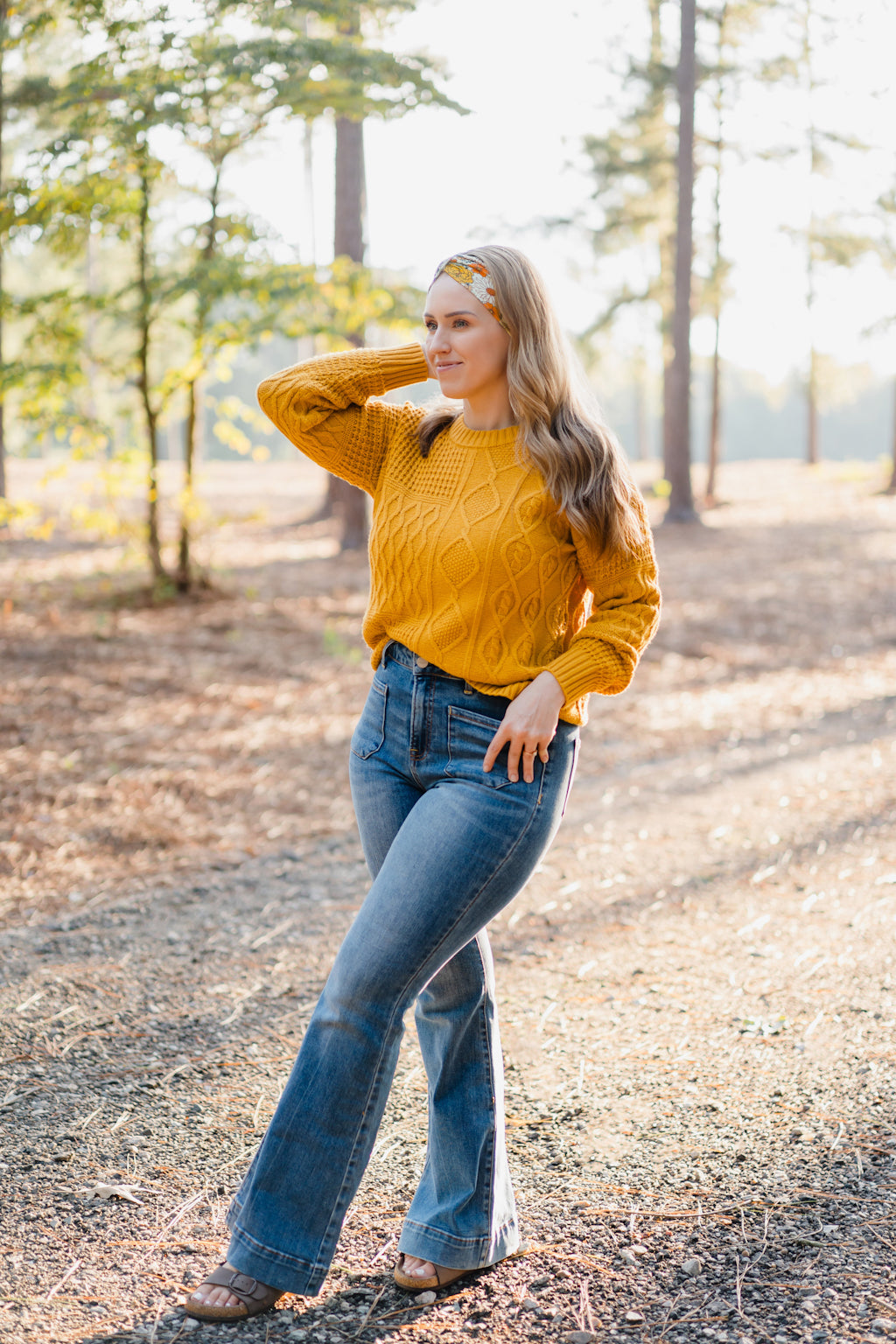 Woman wearing the Golden Harvest headband, part of the Jen Hamilton Collection, showcasing its versatile 3-in-1 twist style, perfect for workouts, long shifts or daily wear.