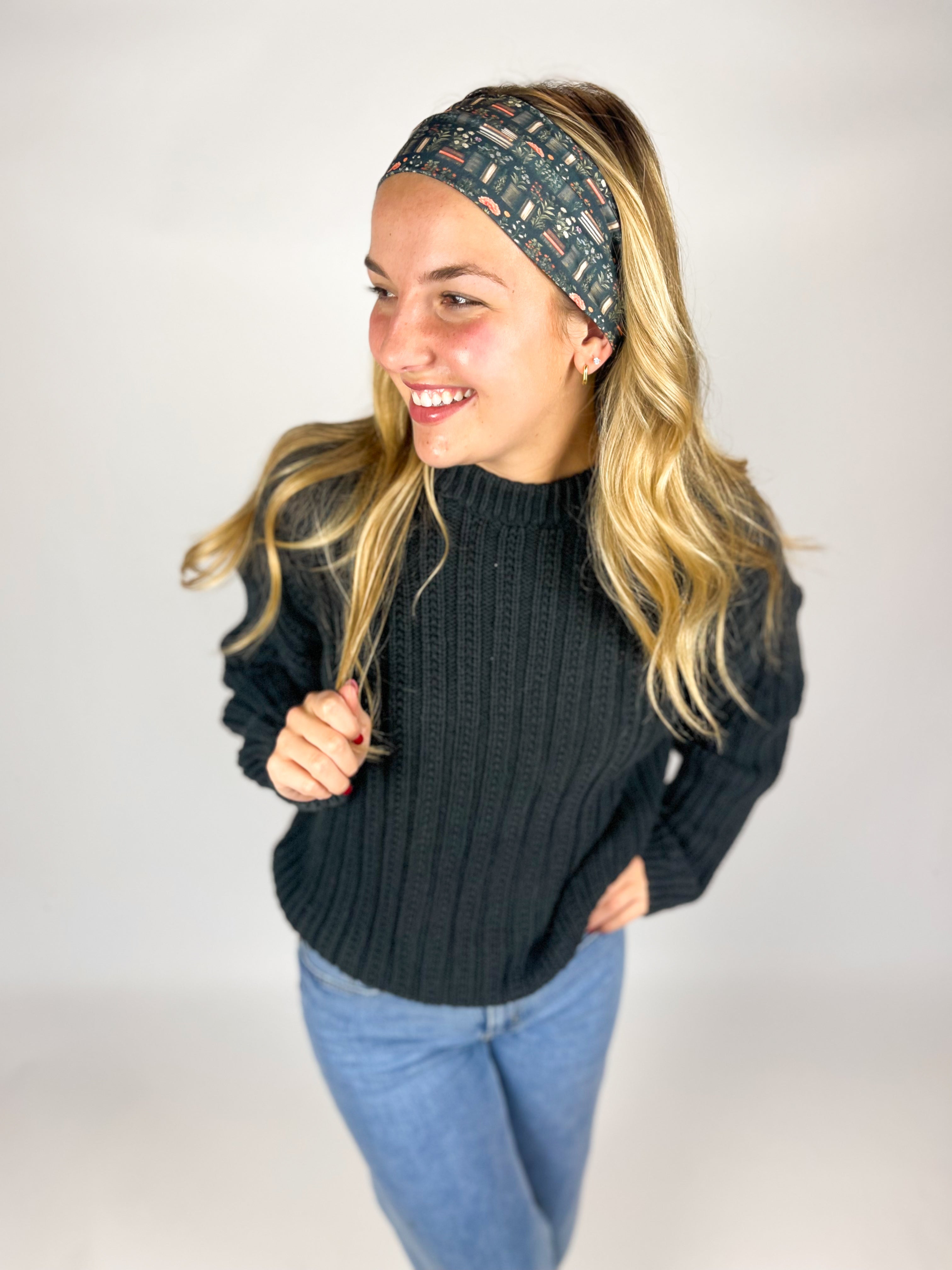 Woman wearing The Enchanted Garden headband, showcasing its versatile 3-in-1 twist style and buttery-soft, non-slip fabric, ideal for work or play.