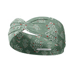 Adult women's sage headband with slightly lighter sage spots and white stethoscopes in the shape of Christmas trees