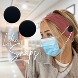 Schwarze lila Druckknöpfe