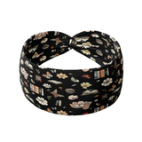 Midnight Mystery black headband featuring floral blooms, stacks of books and open books, crafted from a buttery-soft, ultra-stretchy poly-knit blend, designed for reliable non-slip comfort.