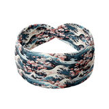 The Great Wave headband features a cherry blossom and waves design, made from a soft, stretchy poly-knit blend for versatile, non-slip wear.