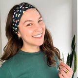 Woman with long hair confidently smiles in the You're My Lucky Charm headband, the perfect non-slip hair accessory for all day wear.