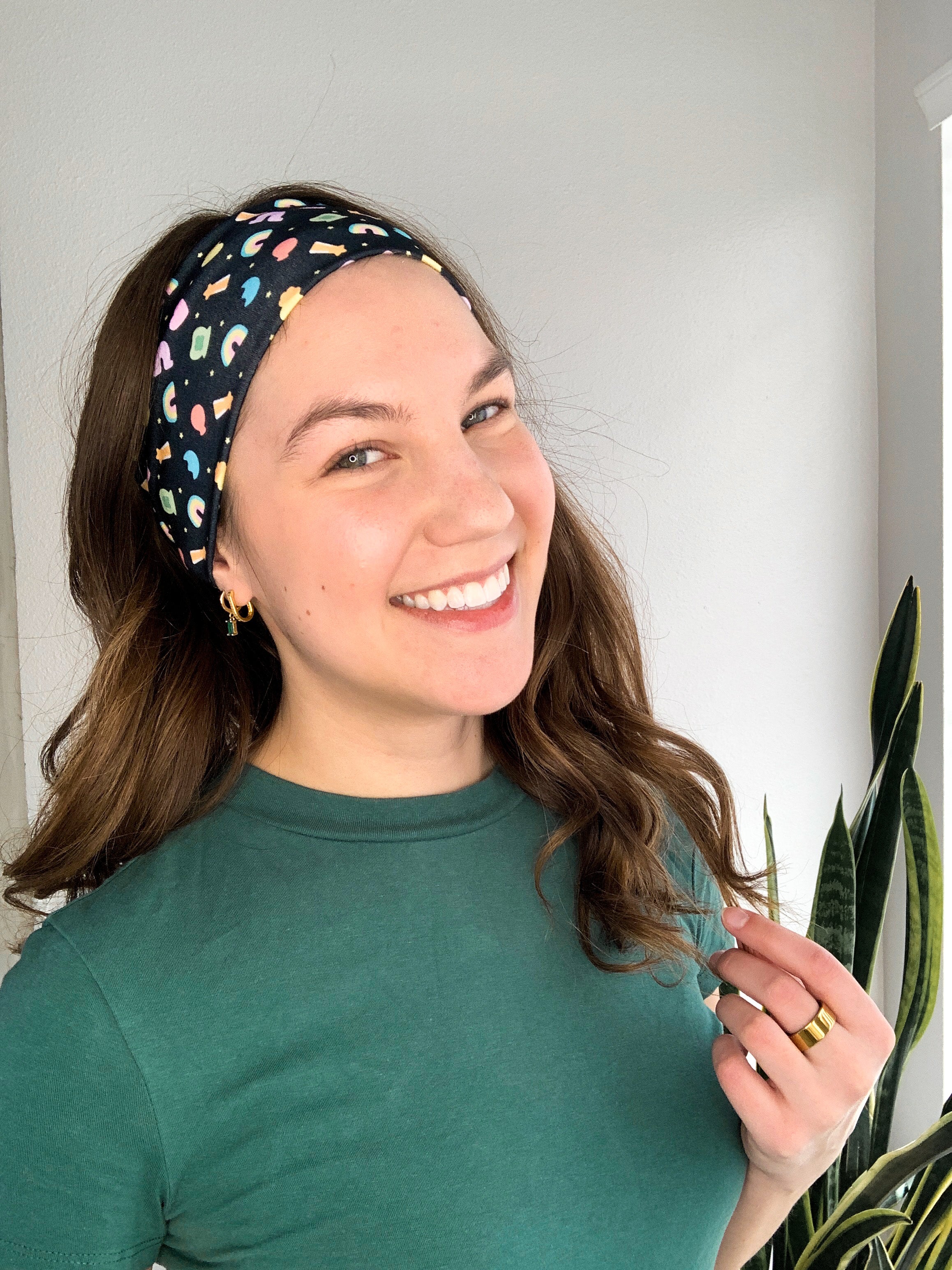 Woman with long hair confidently smiles in the You're My Lucky Charm headband, the perfect non-slip hair accessory for all day wear.