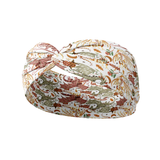 Bloom & Blaze white headband featuring artistic gold, green and red dragons, crafted from a buttery-soft, ultra-stretchy poly-knit blend, designed for reliable non-slip comfort.