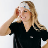 A nurse smiling with long hair while wearing theHeeler at Heart headband for cute hairstyles and comfortable all-day wear.