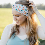 Hen & Harvest headband worn confidently by a woman with long hair, highlighting its twist style and versatility for workouts, long shifts, or play days.