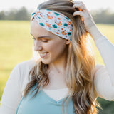 Hen & Harvest headband worn confidently by a woman with long hair, highlighting its twist style and versatility for workouts, long shifts, or play days.