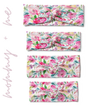 Riley Floral on Ivory headbands in adult, child, toddler and baby sizes. Adjustable bow tie style for all ages, machine washable, ultra-soft poly-knit blend. Designed in Springfield, MO.