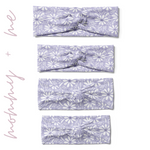 Darby Floral on Purple headbands in adult, child, toddler and baby sizes. Adjustable bow tie style for all ages, machine washable, ultra-soft poly-knit blend. Designed in Springfield, MO.
