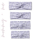 Darby Floral on Purple headbands in adult, child, toddler and baby sizes. Adjustable bow tie style for all ages, machine washable, ultra-soft poly-knit blend. Designed in Springfield, MO.