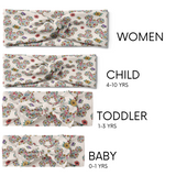 Group of EST. 1923 - Mommy & Me twist knot headbands, featuring floral Mickey Mouse patterns, various sizes for adults, children, and adjustable bow pieces for toddlers and babies.