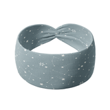 Lost in Space soft blue headband featuring white constellations, made from a soft, stretchy poly-knit blend for versatile, non-slip wear.