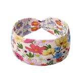 Sydney Floral on Beige headband featuring red, blue, yellow and pink flowers, crafted from a buttery-soft, ultra-stretchy poly-knit blend, designed for versatility and comfort.