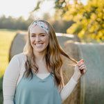 Hen & Harvest headband worn confidently by a woman with long hair, highlighting its twist style and versatility for workouts, long shifts, or play days.