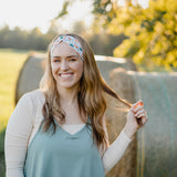 Hen & Harvest headband worn confidently by a woman with long hair, highlighting its twist style and versatility for workouts, long shifts, or play days.