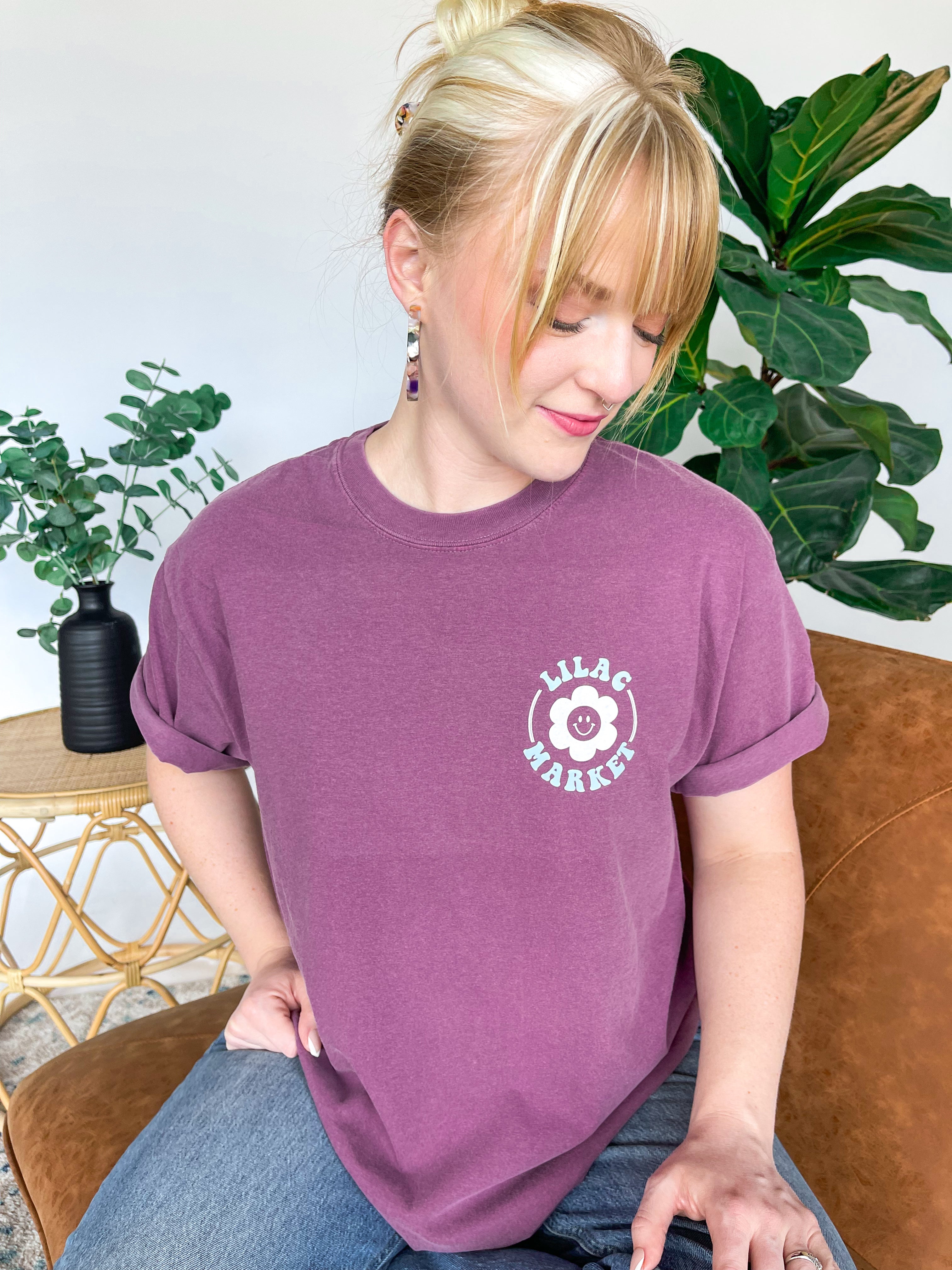 Adult women's vintage berry colored oversized tee shirt with a small Lilac Market logo on the front and a 70's vintage print saying "Lilac Market Headbands" in orange, blue, tan and lilac on the back