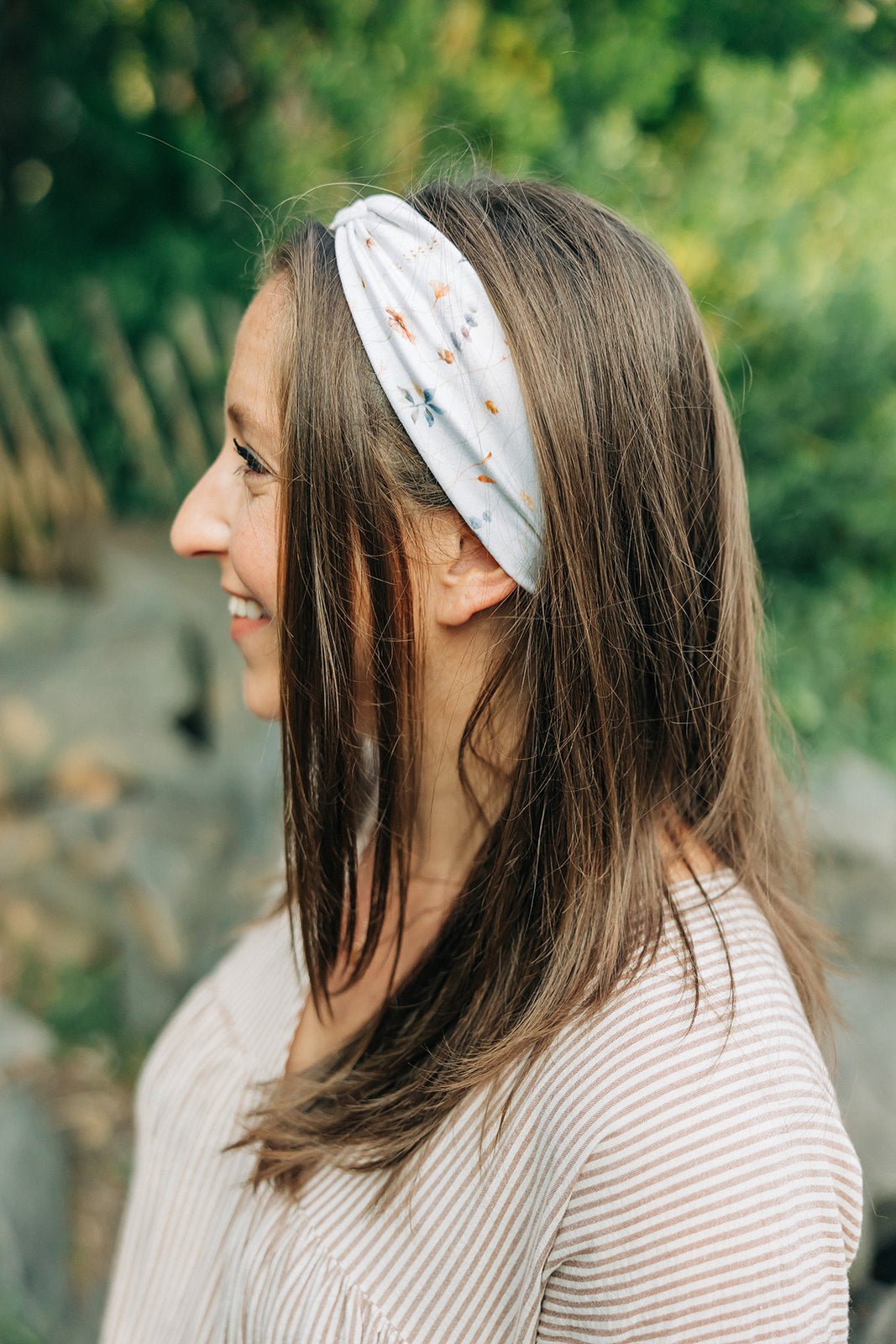 Sarah Floral on Ivory headband featuring a white base adorned with floral designs, crafted in a buttery-soft, ultra-stretchy poly-knit blend for versatile wear.