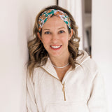 Adult women's beige headband with teal, orange and white floral print