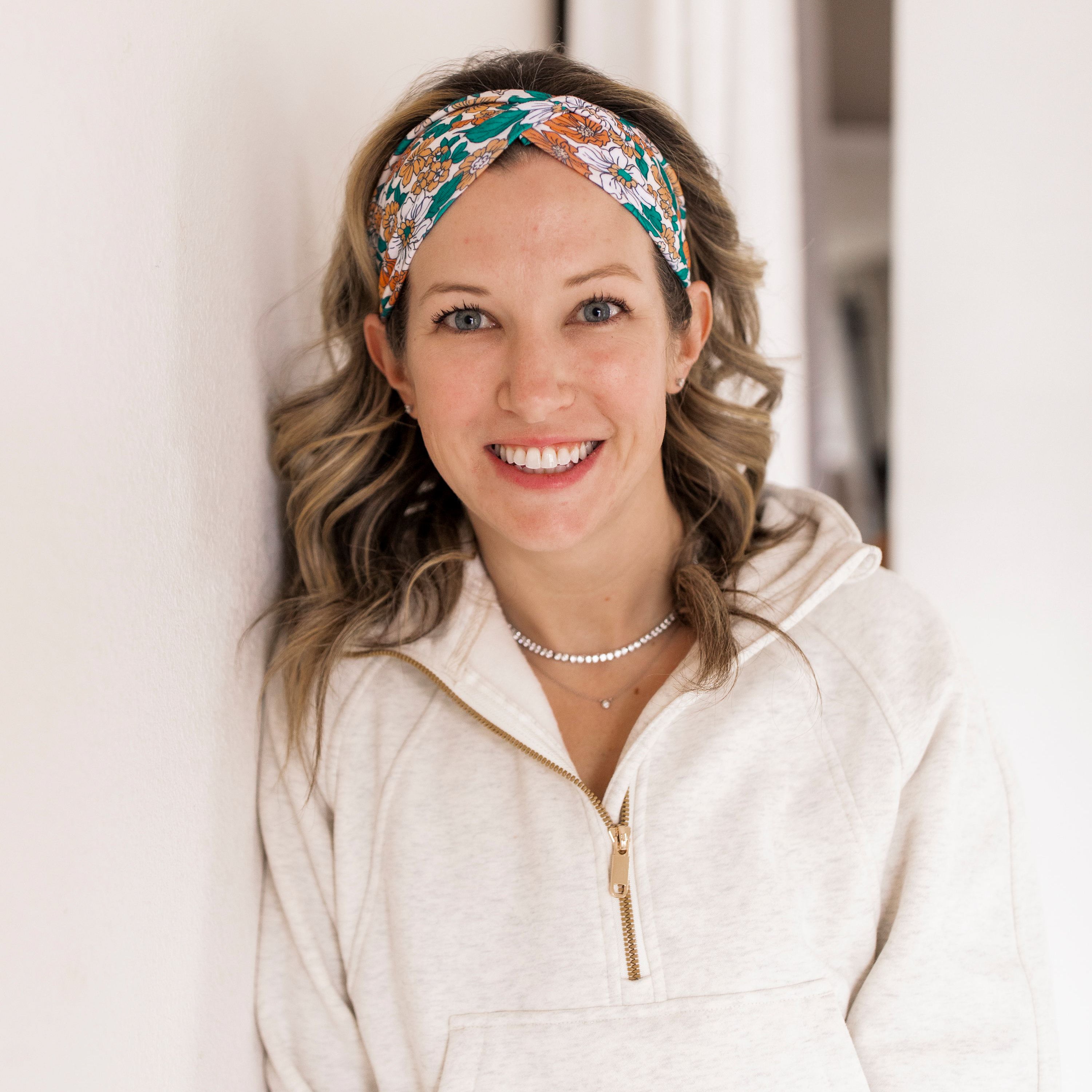 Adult women's beige headband with teal, orange and white floral print