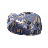 Fully Booked blue headband featuring books on a bookshelf and handwritten scripts of "so many books, so little time" and "It's a good day to read a book", crafted from a buttery-soft, ultra-stretchy poly-knit blend, designed for reliable non-slip comfort.