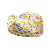 Juniper Floral on Ivory headband featuring watercolor flowers with periwinkle, pink and butter yellow, crafted from a buttery-soft, ultra-stretchy poly-knit blend, designed for versatility and comfort.