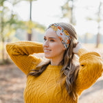 Woman wearing the Golden Harvest headband, part of the Jen Hamilton Collection, showcasing its versatile 3-in-1 twist style, perfect for workouts, long shifts or daily wear.