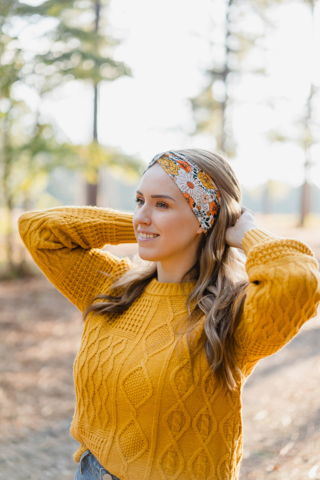 Woman wearing the Golden Harvest headband, part of the Jen Hamilton Collection, showcasing its versatile 3-in-1 twist style, perfect for workouts, long shifts or daily wear.