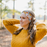 Woman wearing the Golden Harvest headband, part of the Jen Hamilton Collection, showcasing its versatile 3-in-1 twist style, perfect for workouts, long shifts or daily wear.