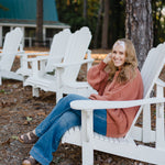 Woman wearing the Flourish headband, showcasing its versatile 3-in-1 twist style and cozy fall charm, part of The Jen Hamilton Collection.