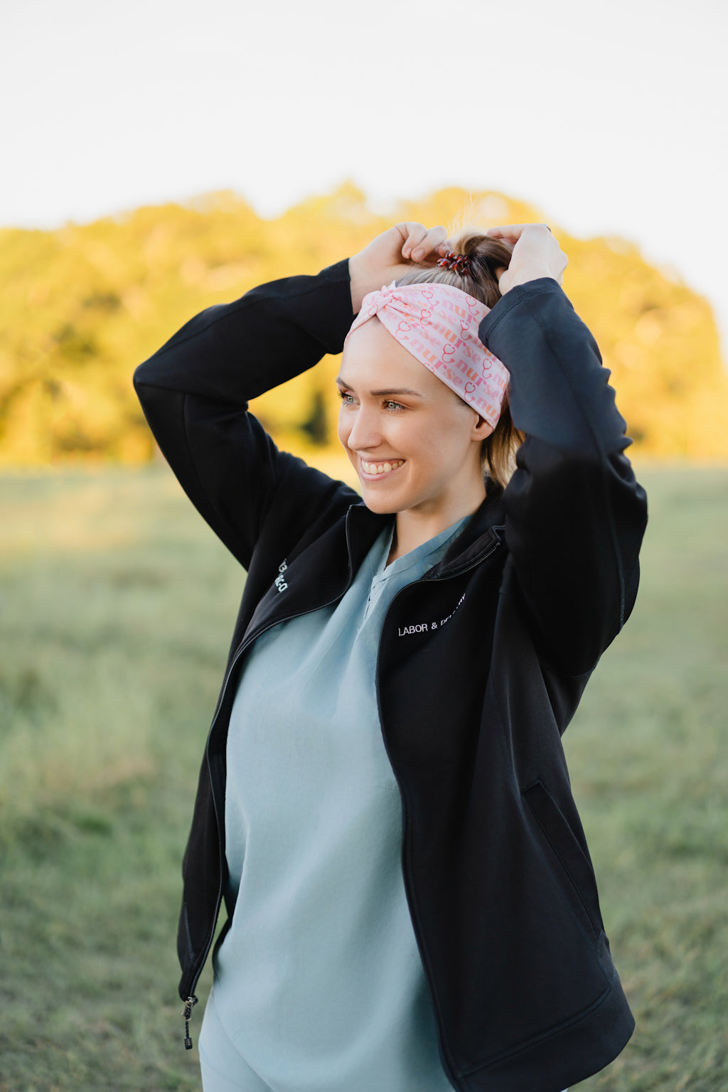 Woman in scrubs wearing a Nurse headband, showcasing its versatile, non-slip design, perfect for workouts or long shifts.