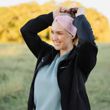 Woman in scrubs wearing a Nurse headband, showcasing its versatile, non-slip design, perfect for workouts or long shifts.