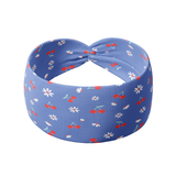 Cherry on Top headband featuring white flowers and red cherries on a blue background. Versatile, non-slip design, ideal for workouts, long shifts, or casual wear.