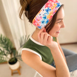 Woman confidently wearing the April Floral on Ivory headband for easy hairstyles and functional wear.
