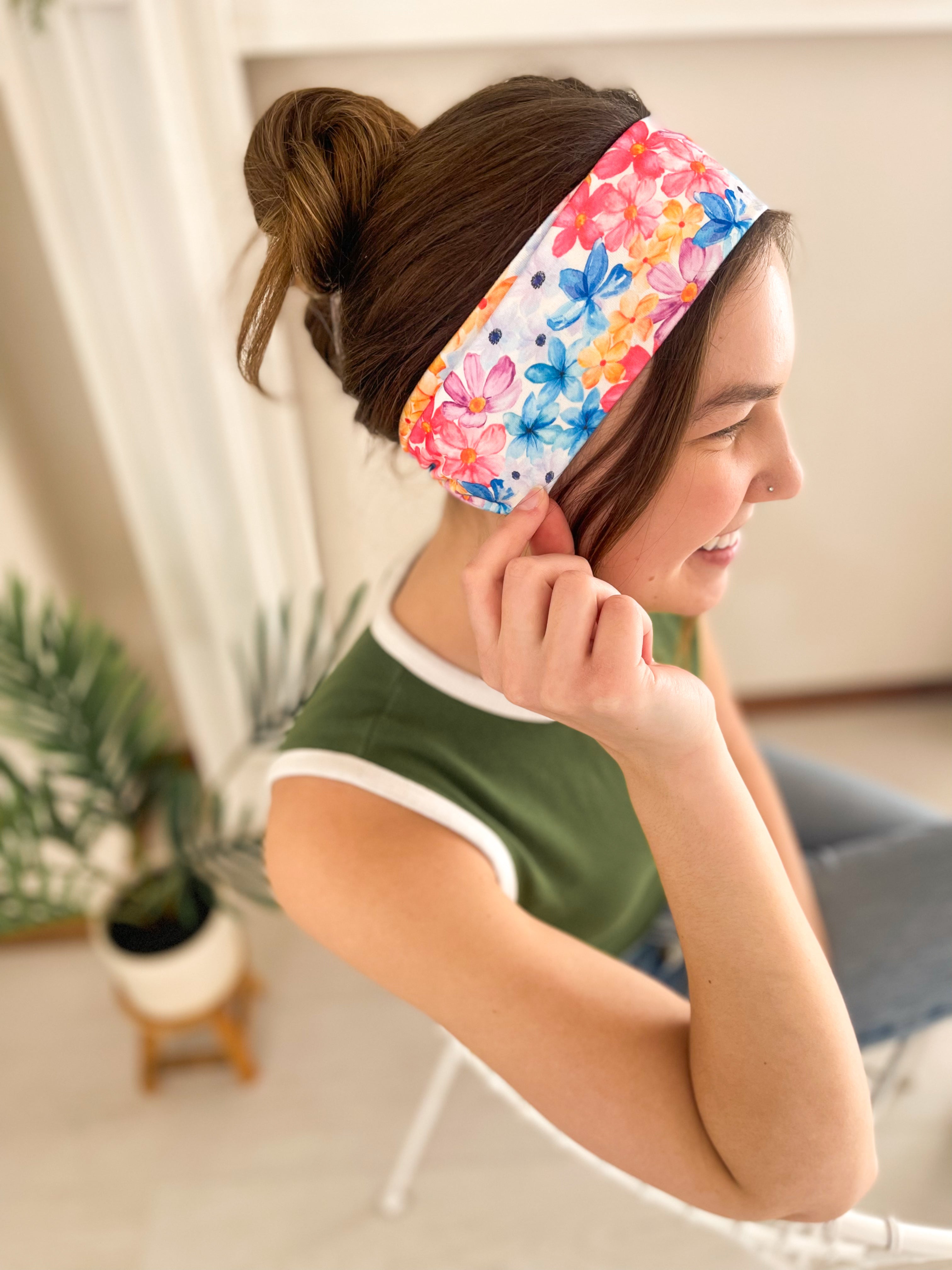 Woman confidently wearing the April Floral on Ivory headband for easy hairstyles and functional wear.