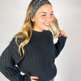 Woman wearing The Enchanted Garden headband, showcasing its versatile 3-in-1 twist style and buttery-soft, non-slip fabric, ideal for work or play.