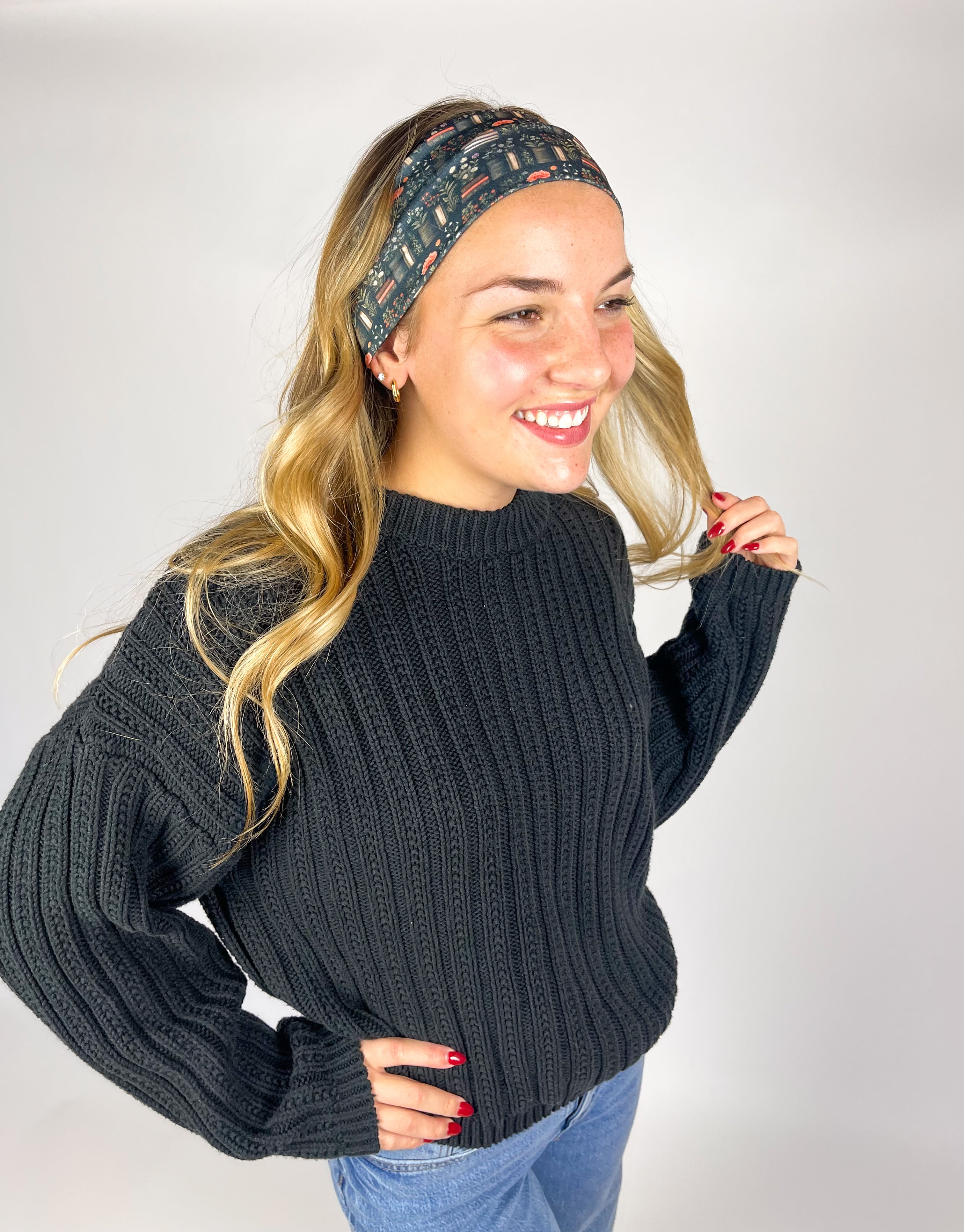 Woman wearing The Enchanted Garden headband, showcasing its versatile 3-in-1 twist style and buttery-soft, non-slip fabric, ideal for work or play.
