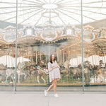 Woman smiling, wearing The Corey headband, a versatile and functional poly-knit blend from The Sarah Wallace Collection, the perfect accessory for easy hairstyles.