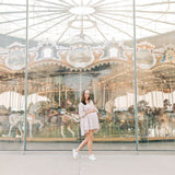 Woman smiling, wearing The Corey headband, a versatile and functional poly-knit blend from The Sarah Wallace Collection, the perfect accessory for easy hairstyles.