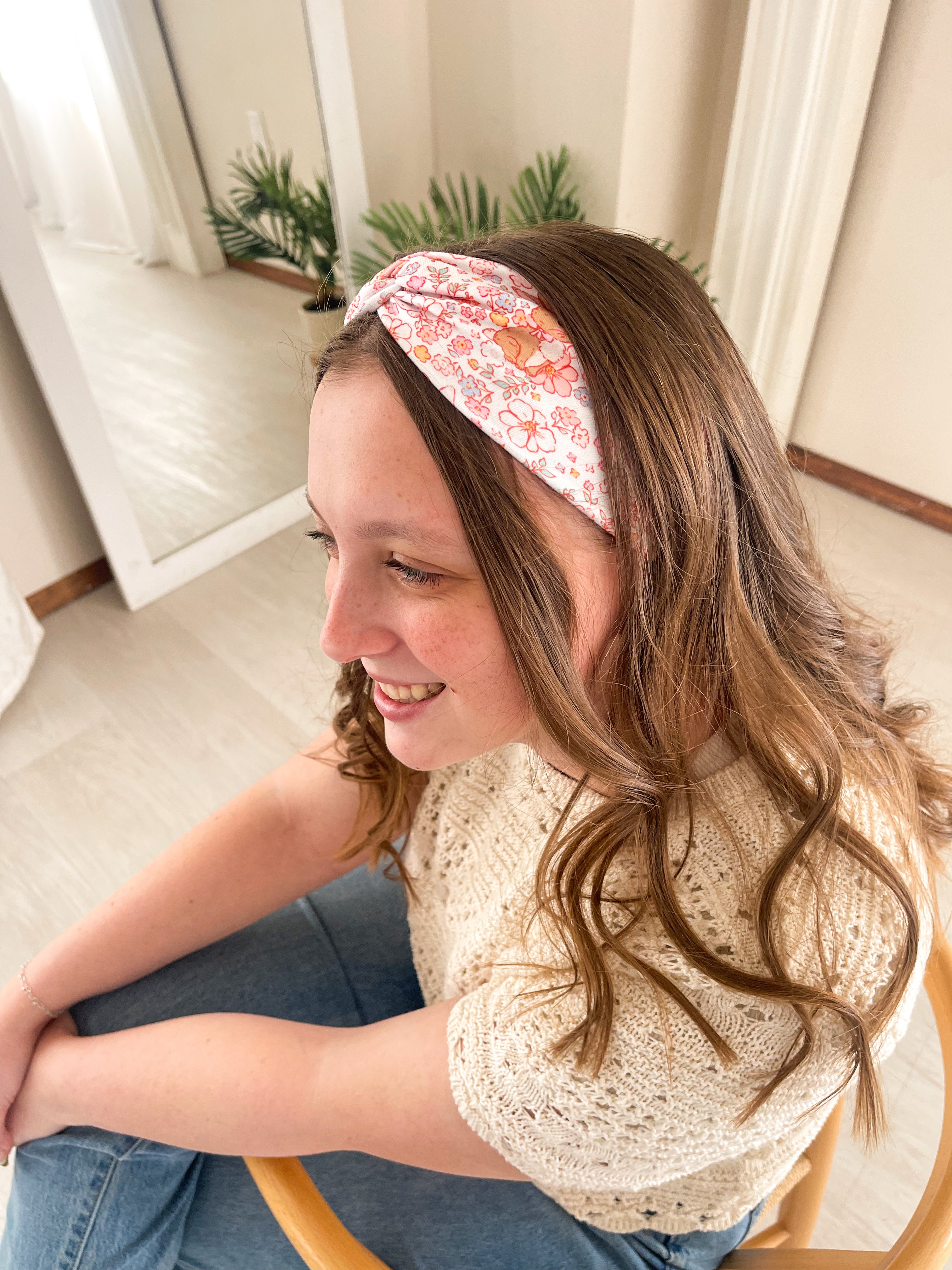 Woman confidently wearing the Hunny Bunny headband for easy hairstyles and functional wear.