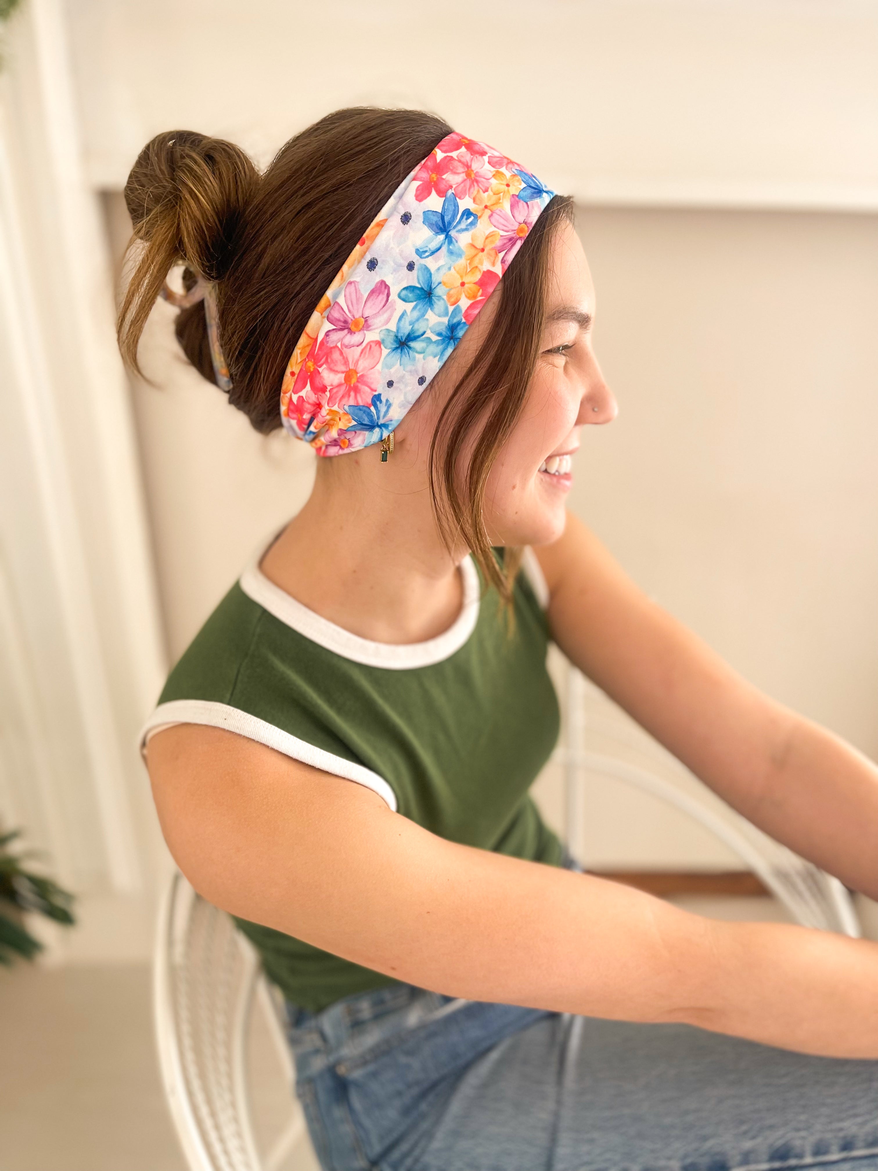 Woman confidently wearing the April Floral on Ivory headband for easy hairstyles and functional wear.