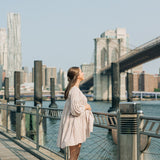 Woman wearing the New York Minute Lilac Clip, a 4.2-inch metal hair accessory from The Sarah Wallace Collection.