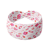Just Here for the Free Gloves white headband featuring pink medical items like stethoscopes, bandages, syringes and hearts, crafted from a buttery-soft, ultra-stretchy poly-knit blend, the most comfortable hair accessory ever.