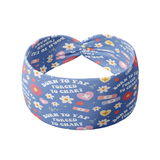 Born to Yap, Forced to Chart blue headband featuring daisies, hearts and band aids with the script "Born to yap, forced to chart", crafted from a buttery-soft, ultra-stretchy poly-knit blend, the most comfortable hair accessory ever.
