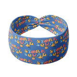 Stork Squad blue headband with stork carrying a bag with a heart pattern. Functional, versatile design for confidence in any activity.
